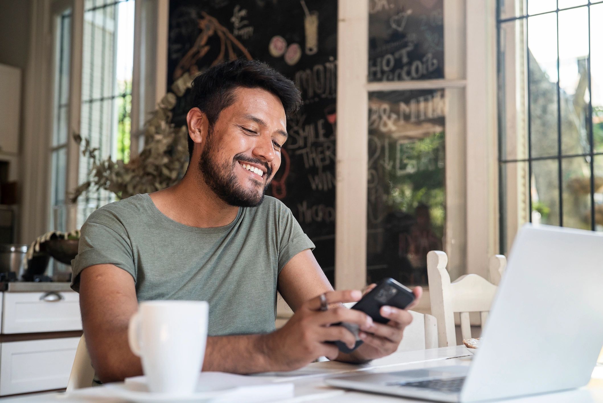 Mobile app user reviewing a smartphone